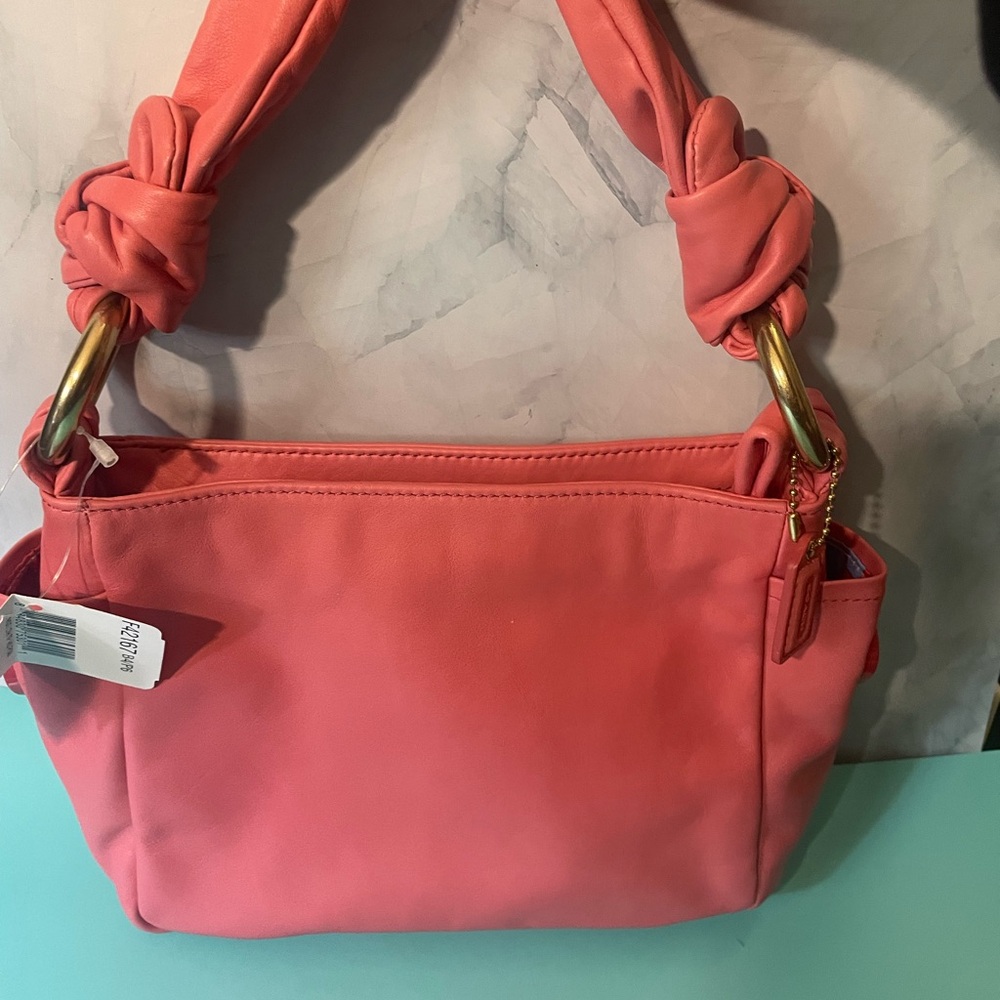 Coach pink Knotted Handle bag. Think Easter, Mother’s Day, Prom or Graduation!!